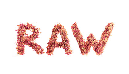 Food typography word Raw made of dried rose petals. Clean and healthy eating concept. Isolated on white background