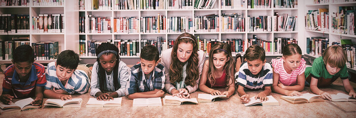 Teacher reading books to her students