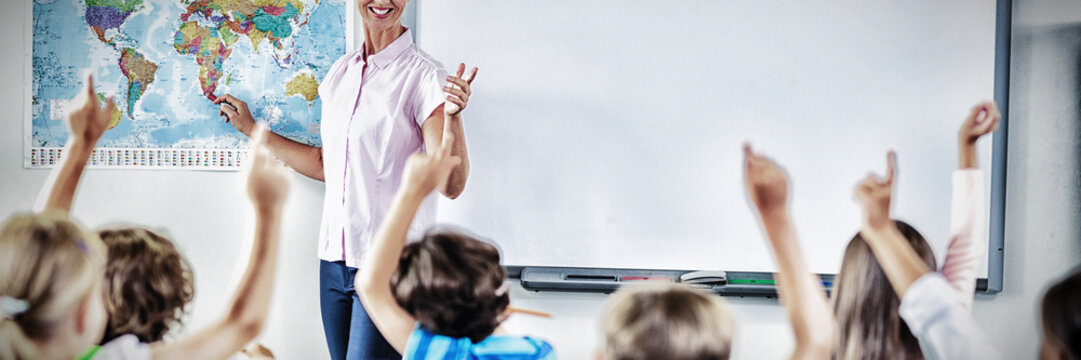 Teacher teaching kids in classroom - Powered by Adobe