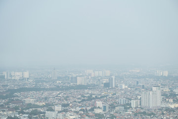 Fototapeta na wymiar Smog dust air pollution in city of Jakarta, Indonesia
