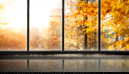 Naklejka na ściany i meble Desk of free space and blurred background of window 