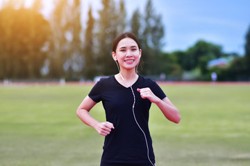 Runner women listening music running or jogging