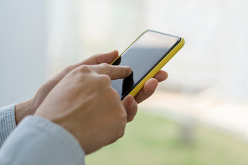Businessman using smart phone, world of smartphone in everyday life, Social media life style.