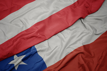 waving colorful flag of chile and national flag of austria.