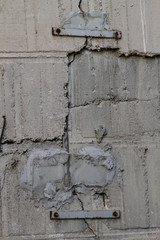 Strengthening of the crack in the retaining wall made of concrete. Cracked concrete wall. Strengthening the cracked wall.