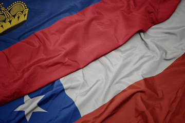 waving colorful flag of chile and national flag of liechtenstein.