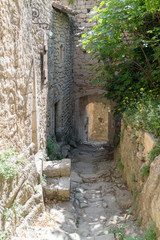 Narrow alley in Oppede le Vieux village in France
