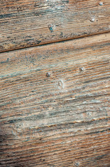 Obraz premium Wooden panels and boards of a rural house, Italy. Walls and ornaments in painted wood for the country house, ruined by time.