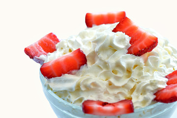 Bowl of strawberries with cream.