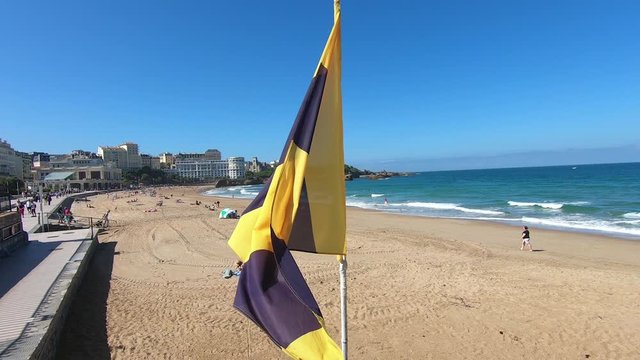flag at Beach in Biarritz, France. La Grande Plage, Aquitaine, France