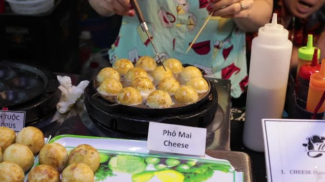 night market in Vietnam on the island. cooking Vietnamese sweets