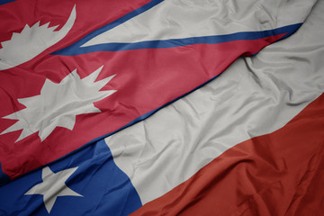 waving colorful flag of chile and national flag of nepal.