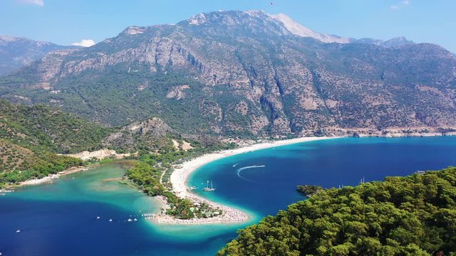 &Ouml;l&uuml;deniz is a resort village on the southwest coast of Turkey. It&rsquo;s known for the blue lagoon of &Ouml;l&uuml;deniz Tabiat Parki and the wide, white Belcekiz Beach. 