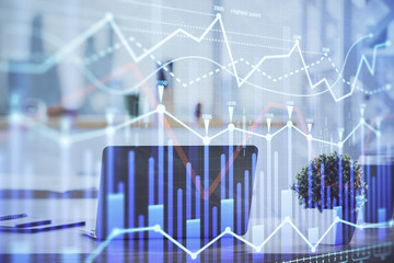 Stock market graph and table with computer background. Double exposure. Concept of financial analysis.