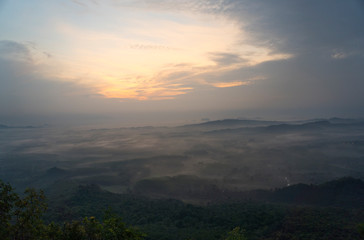 Magical sunet with sea of clouds. Landscape photo was taken from Wang Pha Mek, highlands of Trang, Thailand.