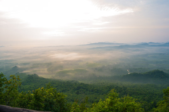 Magical sunet with sea of clouds. Landscape photo was taken from Wang Pha Mek, highlands of Trang, Thailand.
