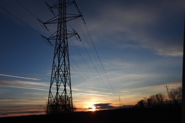 High voltage electric poles sunset