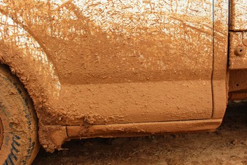 Brown mud stuck on the white car door