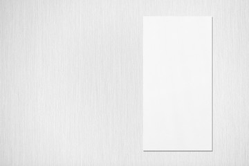 Empty white vertical rectangle price-list or menu mockup with soft shadows on neutral light grey...