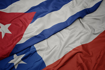 waving colorful flag of chile and national flag of cuba.