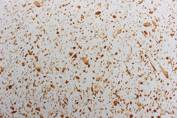 Brown mud stuck on the white car door