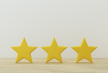 Yellow three star shape on table. The best excellent business services rating for satisfaction.