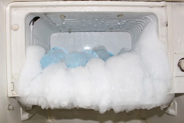 The fridge has a problem with a freezer that has a lot of ice