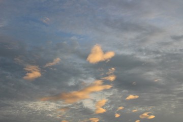 Blue sky and white heart-shaped clouds at sunset, evening, taking pictures blurred