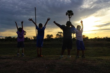 Children travel adventures in the jungle with fun, golden yellow light at sunset