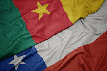 waving colorful flag of chile and national flag of cameroon.