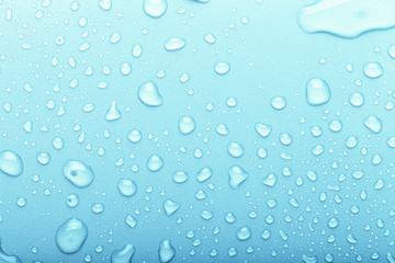 Drops of water on a color background. Selective focus. Blue. Toned