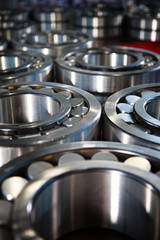 Shiny bearings in production. Finished products. The glossy surface of steel products. Industrial industry concept.