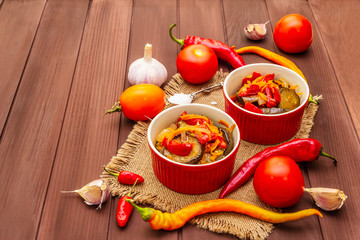 Marinated salad with pickled vegetables: eggplant, carrot, pepper, tomato, garlic