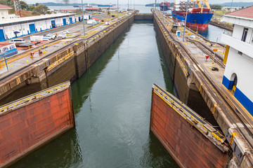 Fototapeta na wymiar Panama Canal locks open to allow ship passage