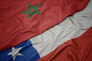 waving colorful flag of chile and national flag of morocco.