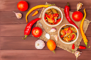 Marinated salad with pickled vegetables: eggplant, carrot, pepper, tomato, garlic