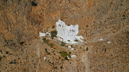 Aerial drone photo of breathtaking whitewashed holy Monastery of Panagia Hozoviotissa built in a...