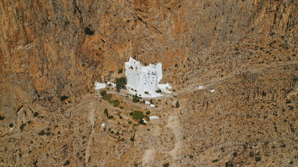 Aerial drone photo of breathtaking whitewashed holy Monastery of Panagia Hozoviotissa built in a...