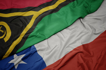 waving colorful flag of chile and national flag of Vanuatu .