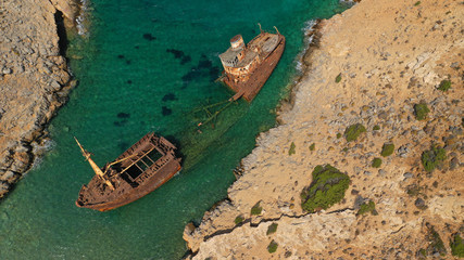 Aerial drone photo of old abandoned rusty shipwreck near area of Kalotaritissa, Amorgos island,...