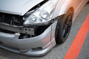 Obraz na płótnie Canvas Close up crash car broken and scratch accident .insurance helping repair service maintenance waiting mechanic examining, Safety inspection test before driving on road, Transportation vehicle service