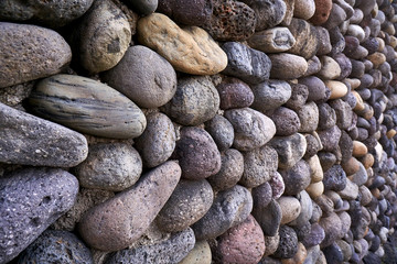 Fototapeta na wymiar A stone wall that can be seen in Jeju Island in Korea.