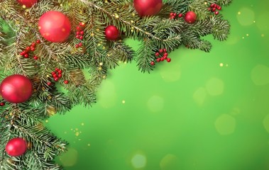 Christmas toys on fir tree branch the blurred lights burning