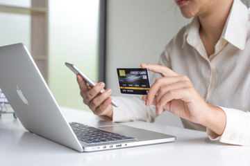 Buy products online, business people are bringing credit cards to pay for purchases. Online credit cards are easy to use.