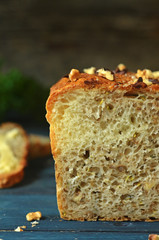 Zucchini bread and with nuts on a blue wooden background