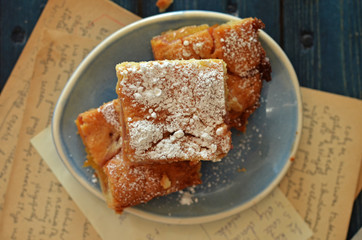 Cake with peaches on a rustic plate
