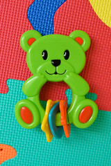 Green teddy bear plastic gravel baby toy.