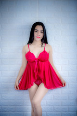 Asian girl in red pajamas