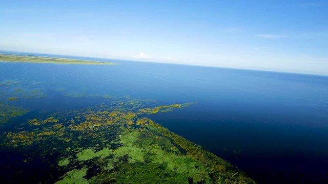 Power paragliding over the open water on a lake in Southern Florida