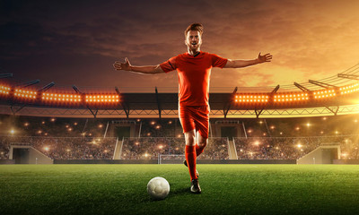Soccer player on a crowded stadium with cheering fans celebrates championship. Dramatic night sky
